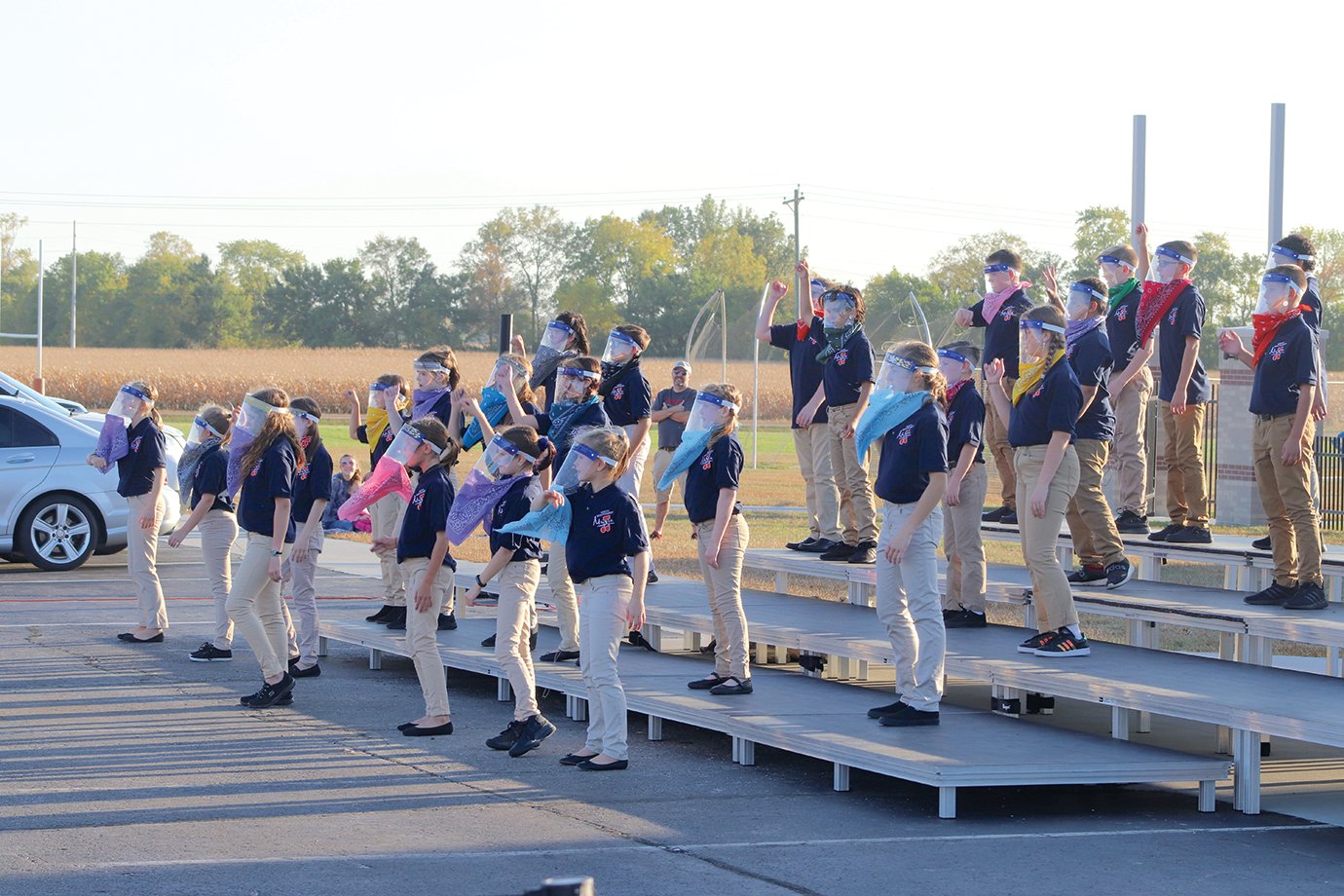 Sixth-grade students perform during a middle school choir concert held in the North Montgomery parking lot Wednesday.